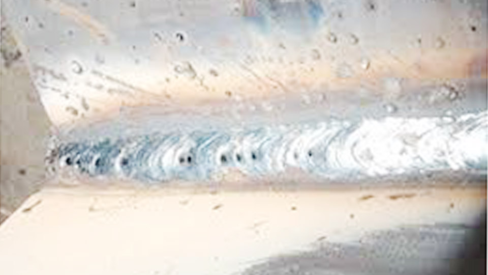 What causes porosity in a weld